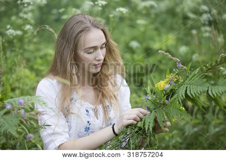 Belarus, The City Of Gomel, July 07, 2018. Holiday Kupala. The Girl Weaves A Wreath For The Kupala N