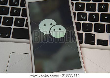 Palo Alto / Usa - August 08 2019: White Iphone With Logo Of Social Media Wechat On The Screen. Socia