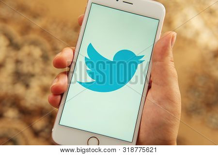 Palo Alto / Usa - August 08 2019: Female Hand With Apple Phone With Logo Of Social Media Twitter On 