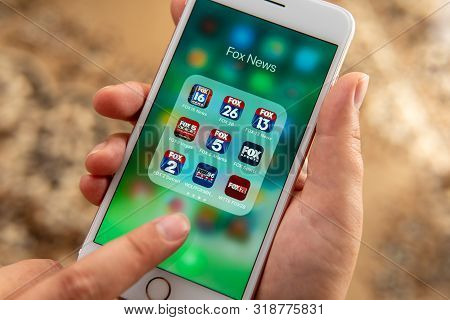 Palo Alto / Usa - August 08 2019: Female Hand Holding White Apple Iphone With Icons Of Different Fox