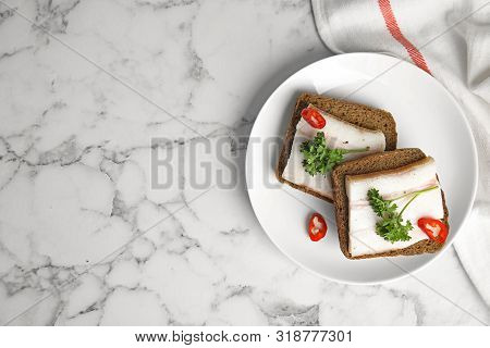 Plate With Pork Fatback Sandwiches On Marble Background, Top View. Space For Text