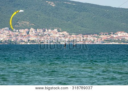 Sunny Beach, Bulgaria July 13, 2019. The Man Practices Hydrofoil Kitesurfing In The Black Sea Off Th