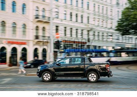 Riga, Latvia - June 9, 2019: Black Ford Ranger Wildtrak Fast Drive In Summer City Street. The Third-