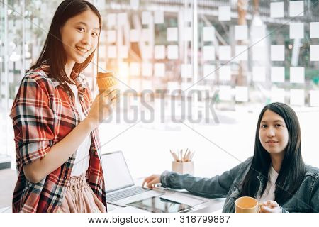 Young Studebt Sitting In Library College Studying And Sharing Knowledge With Laptop Together, Educat