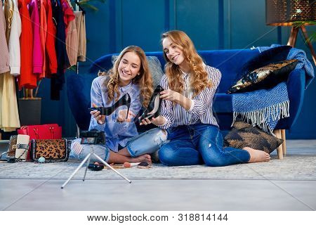Two Handsome Young Woman Discussing Trends Shoes.