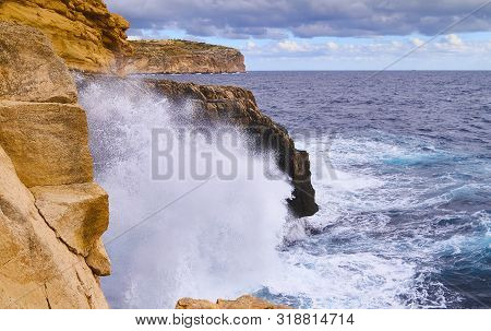 Huge Waves Crash On Cloudy Day. Kemmuna Island