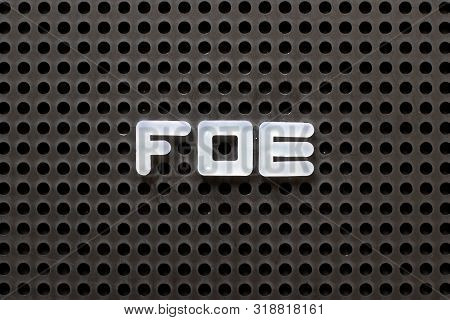 Black Color Pegboard With White Letter In Word Foe