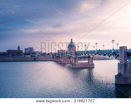 Sunset On A Bridge Of Toulouse Over The Garonne River, France