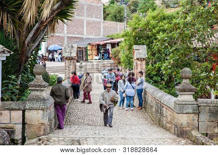 Mongui, Colombia - August, 2019: Tourists And Locals At The Royal Bridge Of Calicanto At The Beautif
