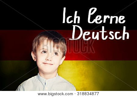 Thinking Child Boy Student Against The Germany Flag Background. Deutsch Concept With Inscription Lea