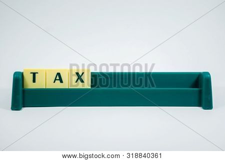 Tax Word Concept Light Background Image Using By Block Letter For Various Purposes Of Tax Return Or 