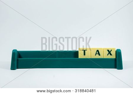 Tax Word Concept Light Background Image Using By Block Letter For Various Purposes Of Tax Return Or 