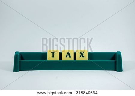 Tax Word Concept Light Background Image Using By Block Letter For Various Purposes Of Tax Return Or 