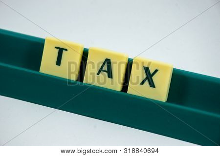 Tax Word Concept Light Background Image Using By Block Letter For Various Purposes Of Tax Return Or 