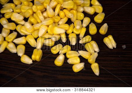 Corn Grains Scattered On A Dark Background
