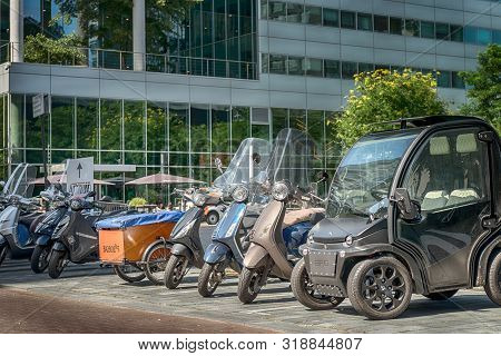 Amsterdam, Gustav Mahlerlaan, The Netherlands, 05/29/2019,  Scooters Parked At The Sidewalk, Modern 