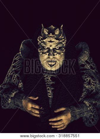 Demon With Scarf On Head Isolated On Black. Alien Or Reptilian Makeup With Sharp Thorns And Warts. H