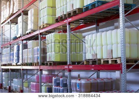 Belarus, The City Of Mensk, April 12, 2019. Chemical Production.warehouse With Shelves, Plastic Cans