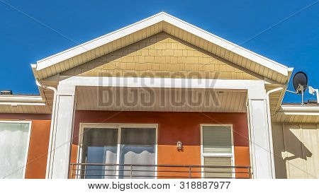 Panorama Frame Close Up Of The Balcony Of A Home With A Combination Of White And Otange Wall
