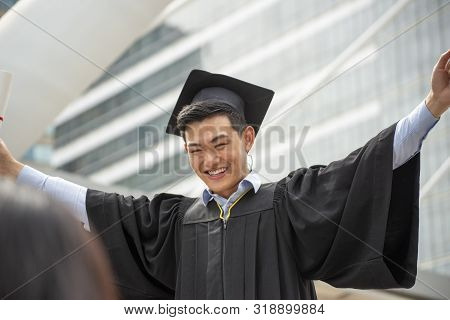 Graduate Student And Success Education In University Concept. Happy Asian Student Man Graduate Diplo
