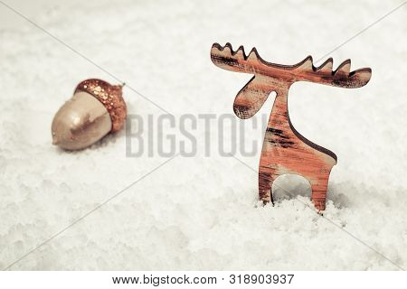 Christmas Background With Handmade Christmas Deer On White Snow Background. Winter Holiday Concept.