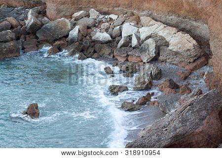 Collapsed Rocks From A Cliff In The Sea