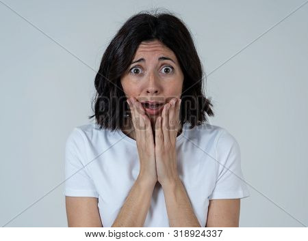 Close Up Of Latin Woman With Frightened Eyes, Shocked Making Fear, Anxiety Gestures. Looking Terrifi
