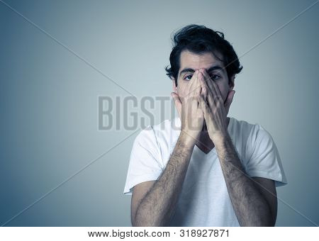 Close Up Portrait Of Young Sensitive Man Feeling In Love Looking Happy, Shy And Lucky. Isolated On N
