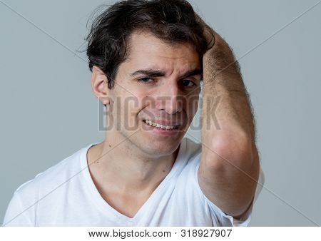 Close Up Portrait Of Young Sensitive Man Feeling In Love Looking Happy, Shy And Lucky. Isolated On N
