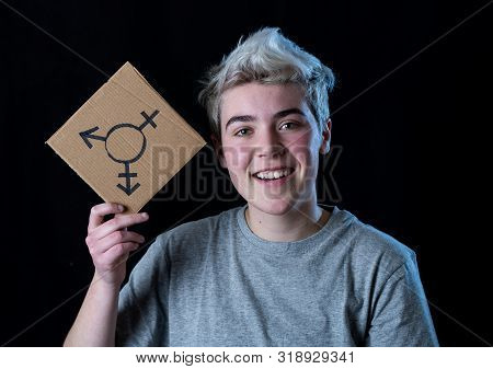 Portrait Of Happy Proud And Confident Trans Teenager Man Holding Transgender Symbol