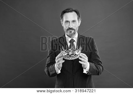 It Is His Proud Boast. Source Of Pride. Proud Businessman Holding Crown Jewel With Pride On Red Back