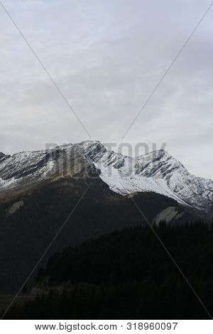 Snowcapped Mountains Seen From A Mountain Road High Up In Switzerland, Europe