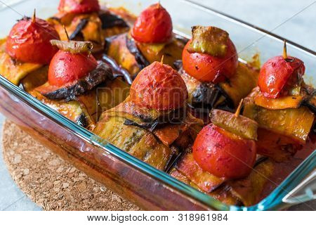 Turkish Islim Kofta Kebab With Meatballs And Cherry Tomatoes Wrapped In Eggplant / Aubergine Slices.