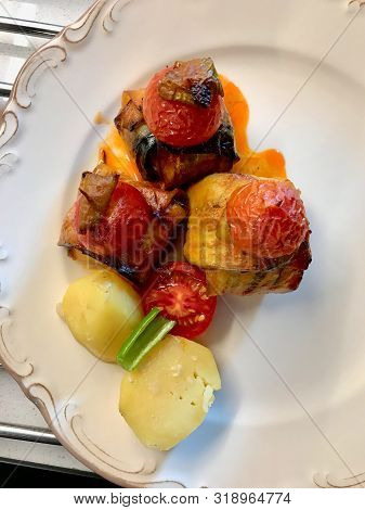 Turkish Islim Kofta Kebab With Meatballs And Cherry Tomatoes Wrapped In Eggplant / Aubergine Slices.