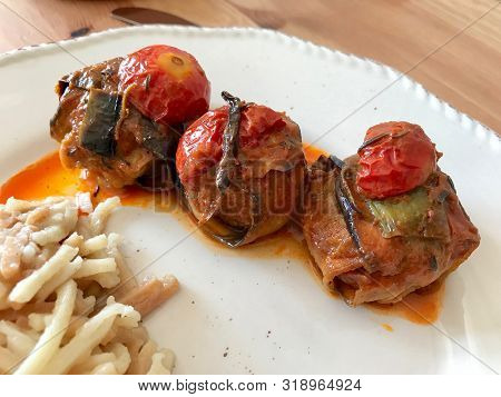 Turkish Islim Kofta Kebab With Meatballs And Cherry Tomatoes Wrapped In Eggplant / Aubergine Slices.