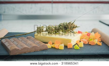 Preparing To Cooking Cake With Cannabis Butter. Concept Of Using Marijuana In Food Industry.
