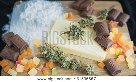 Preparing To Cooking Cake With Cannabis Butter. Concept Of Using Marijuana In Food Industry.