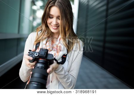 Woman Is A Professional Photographer With Dslr Camera, Outdoor And Sunlight