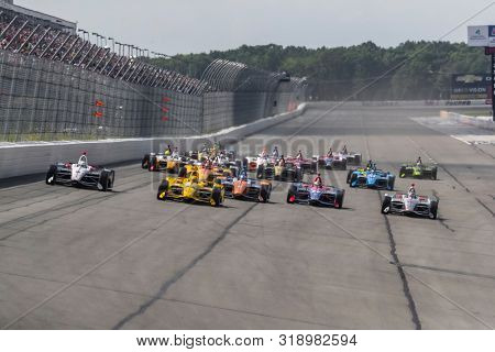 August 18, 2019 - Long Pond, Pennsylvania, USA: The NTT IndyCar Series teams take the green flag to start the race for the ABC Supply 500 at Pocono Raceway in Long Pond Pennsylvania.