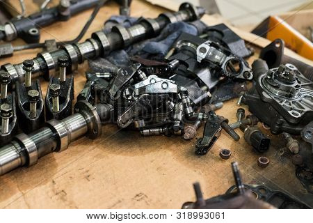 Camshaft, Bolts, Nuts, Rocker Arm Tappet Valve Taken From A Broken Car Top View
