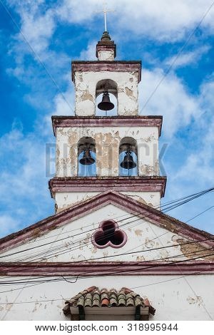Bell Tower Of The Historical Chapel Of San Antonio De Padua Built On 1557 At The Beautiful Small Tow