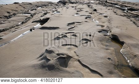 Deepening Relief In The Form Of Craters On Limestone And Rock Near The Sea.