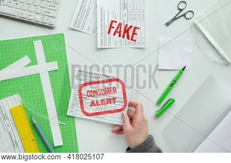 Fake Covid Vaccination Record Card. Covid Scams. Forged Health Certificate With False Vaccination Re