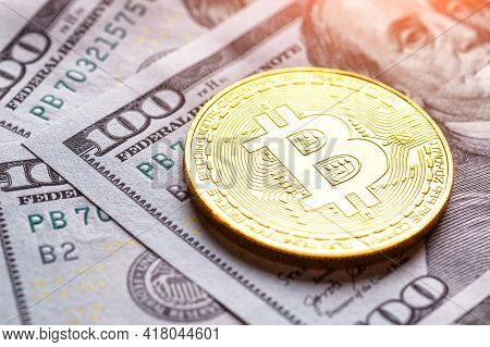 Golden Bitcoin Lies On The Banknotes.new Virtual Money. Crypto Currency Top View. Real Coins Of Bitc