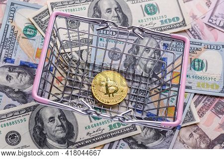 Golden Bitcoin Lies On The Banknotes.new Virtual Money. Crypto Currency Top View. Real Coins Of Bitc