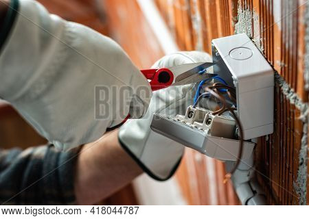 Electrician At Work On A Residential Electrical System. Electricity.