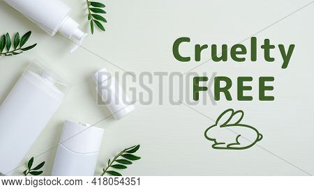 Cruelty Free Cosmetics On Green Background With Leaves. No Animal Testing. Natural Organic Spa Beaut