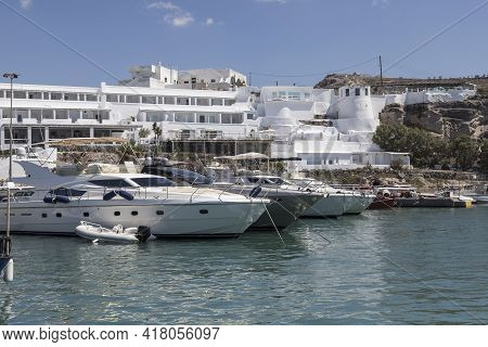 Moored Boats At Vlychada Harbor On Santorini Island In Greece.