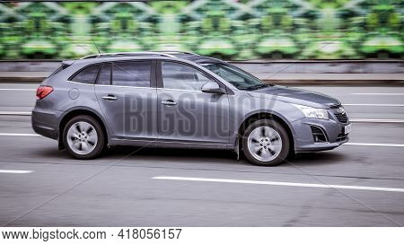 Moscow, Russia - April 2021: Chevrolet Cruze Rides On A Street. Gray 5-door Station Wagon Motor Car 