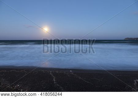 Beautiful Black Beach With Coast And Sea In Vlichada With Blue Sky Background With White Clouds And 